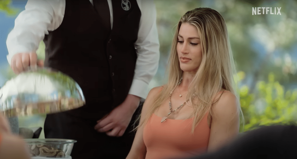 Sydnee opening the snake in the challenge of the million dollar secret trailer